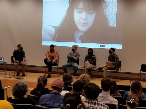 group of people sitting on a stage