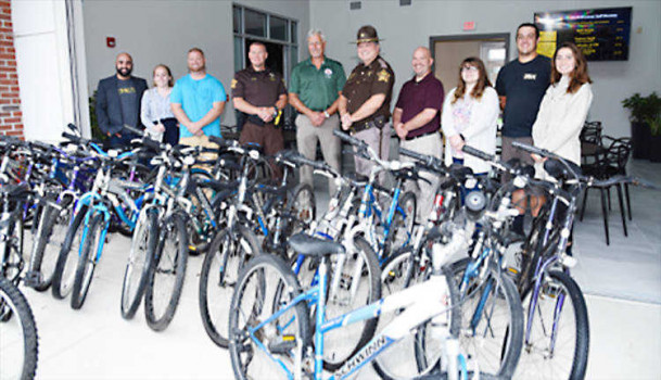 People standing near bikes