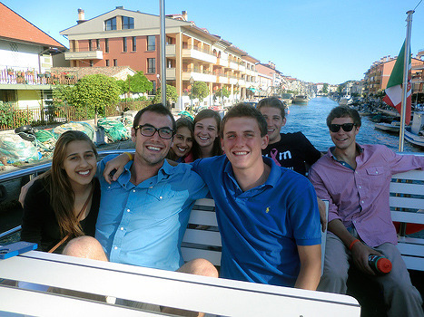 Students smiling during a boat trip
