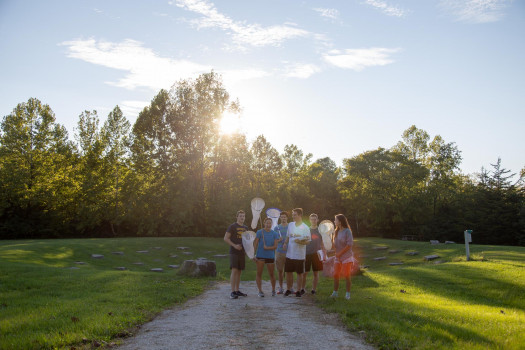 Students at the nature park with butterfly nets