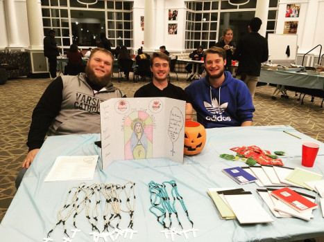 Catholic students distributing rosaries at Union Building