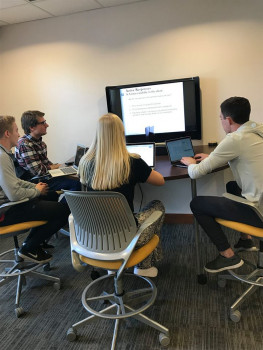 Members of the Consulting Group work on a project