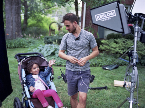 person looking at child in stroller