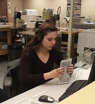 Student preparing an order at Printing Services