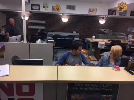 Students collaborating on a rush job at Printing Services