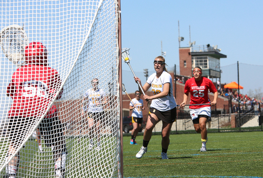 Women's Lacrosse player taking a shot on goal