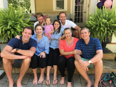 Mike McCracken and family sitting on a porch