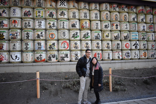 Students with Japanese writing in the background