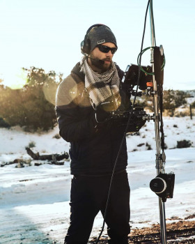 person standing with fishing pole