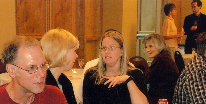 Faculty members sitting at a table during a meeting