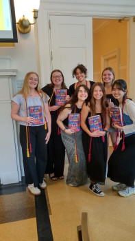 Senior Literature majors with cords and books