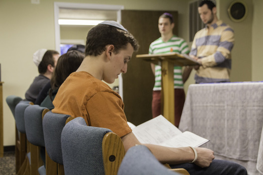 Interfaith Council Member Kyle Winters '17 participates in a Shabbat service led by two former Interfaith Interns, Noam Rose '16 and Alex Alfonso '15.