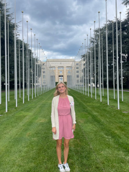 student standing in front of the United Nations lawn