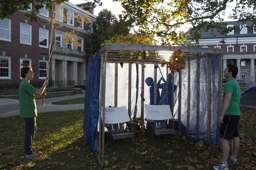 Hillel students preparing the Sukkah