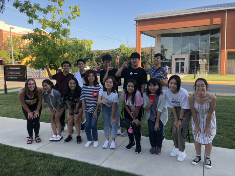 A group of students posing together in front of Peeler