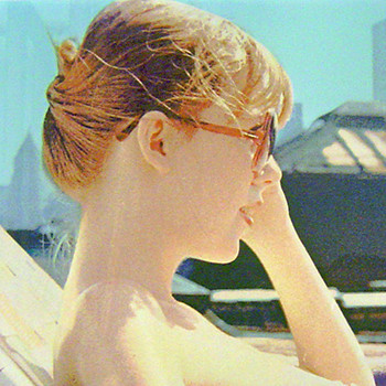 Women pulling down her red sunglass