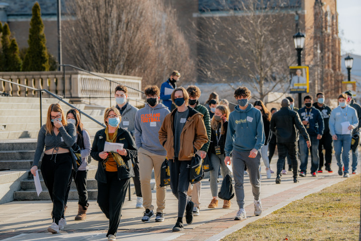 Prospective Students and Guests visiting during a Preview Day admission event. Their are groups depicted going out on campus tours of DePauw.