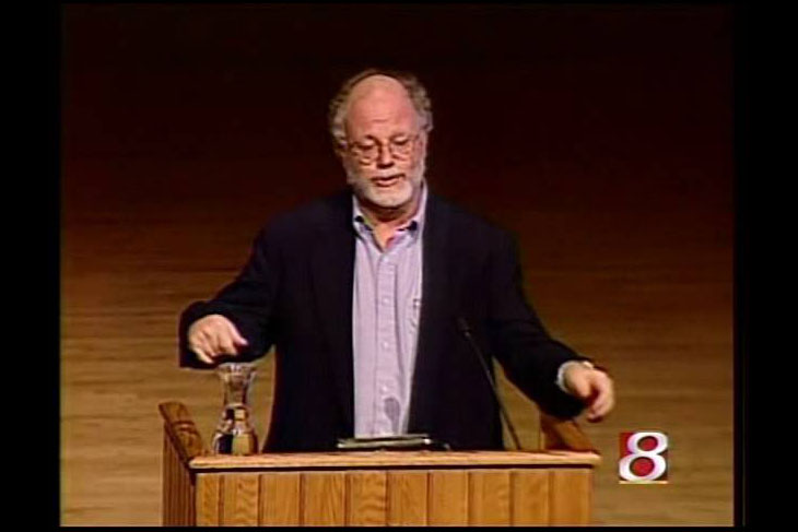 Ben Cohen speaking to the crowd behind a lecturn