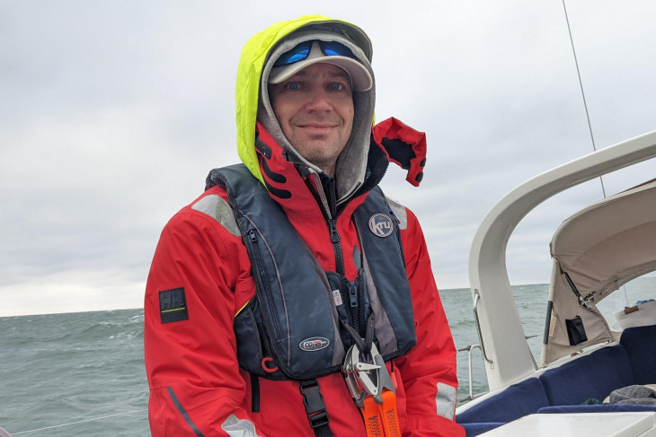 Dan Stotesbery wears rain gear on his boat