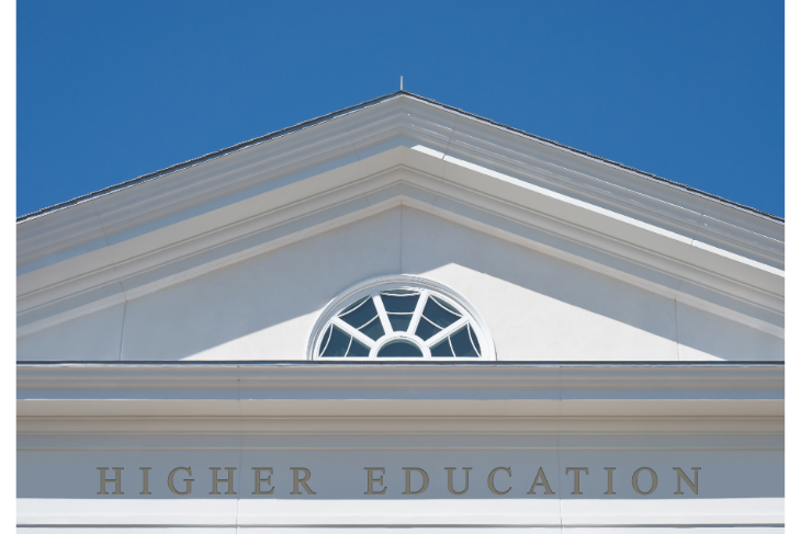 top of a white building with the words higher education on the building