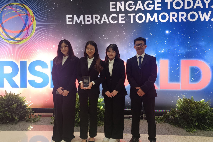 Students standing together at risk management competition