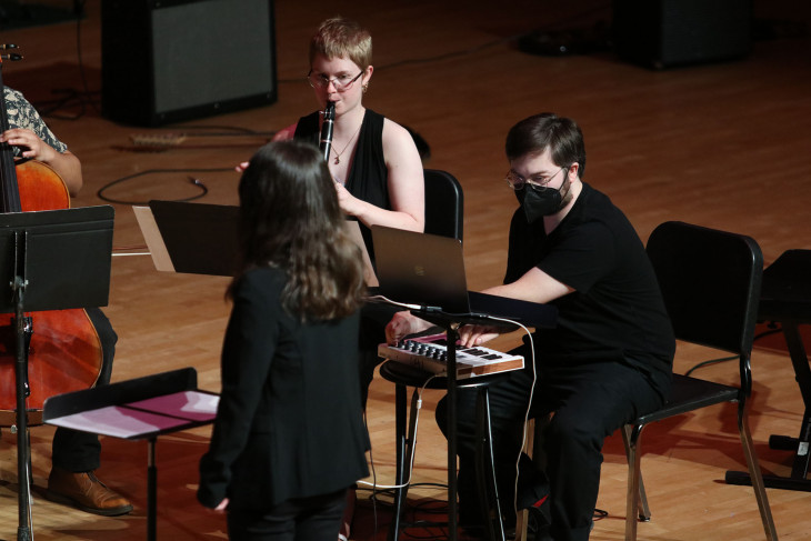 Man playing keyboard instrument and woman playing clarinet