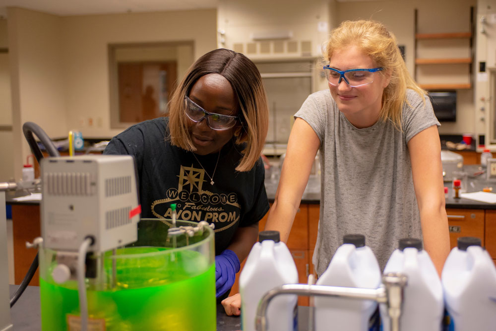 Light and Sam look over a container of sub-zero antifreeze liquid.