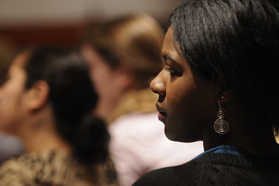 Student listening to a speaker