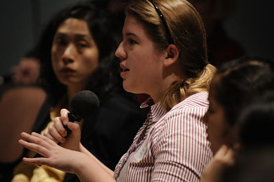 Student with a microphone asking a question