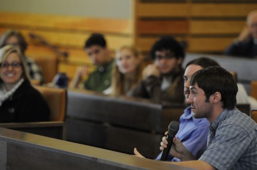 Student asking a question in an ethics session