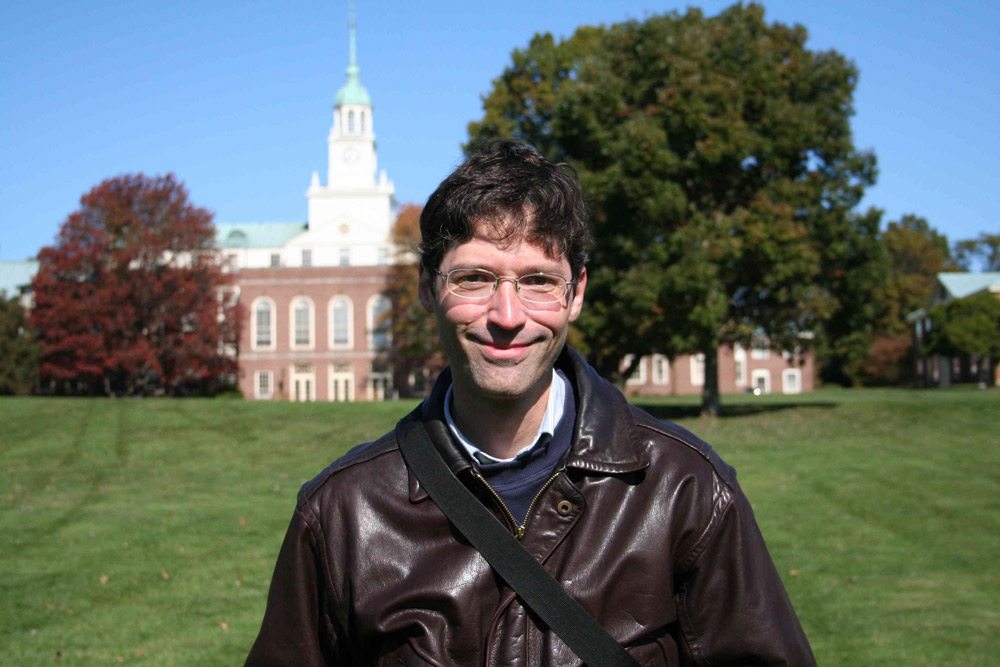 Dr. Alex Komives outside in a scenic location