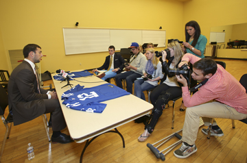 Andrew Luck at a news conference with DePauw student journalists