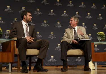 Andrew Luck talking with Bill Lynch on stage