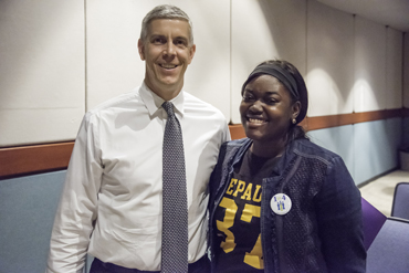 Arne Duncan with a student