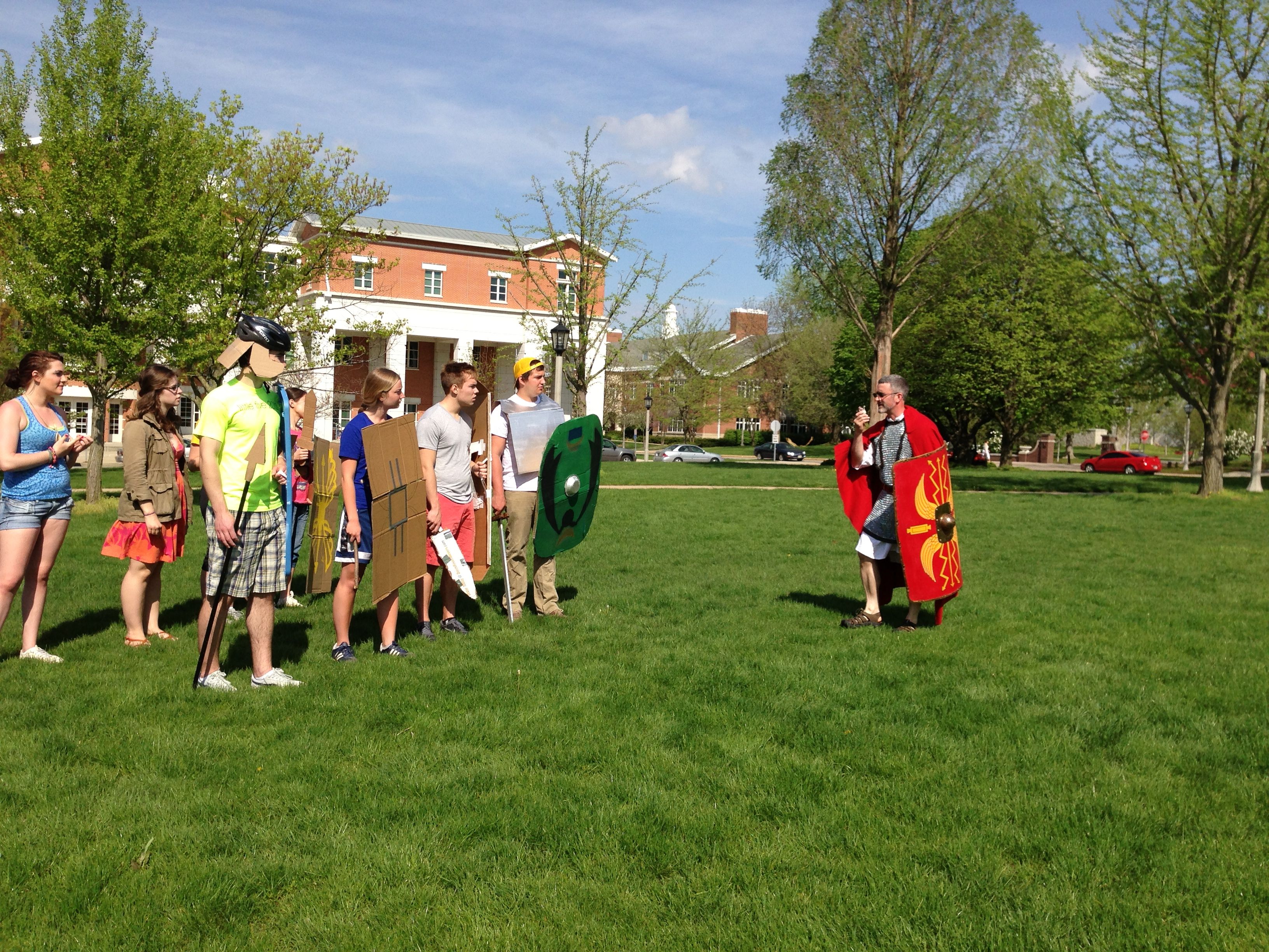 Prof. Foss, as a Roman Centurion working with students