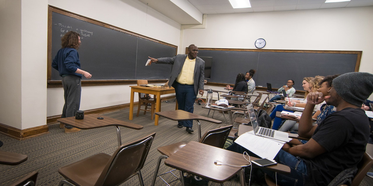 Prof. Emmitt Riley teaches a class in Asbury Hall.