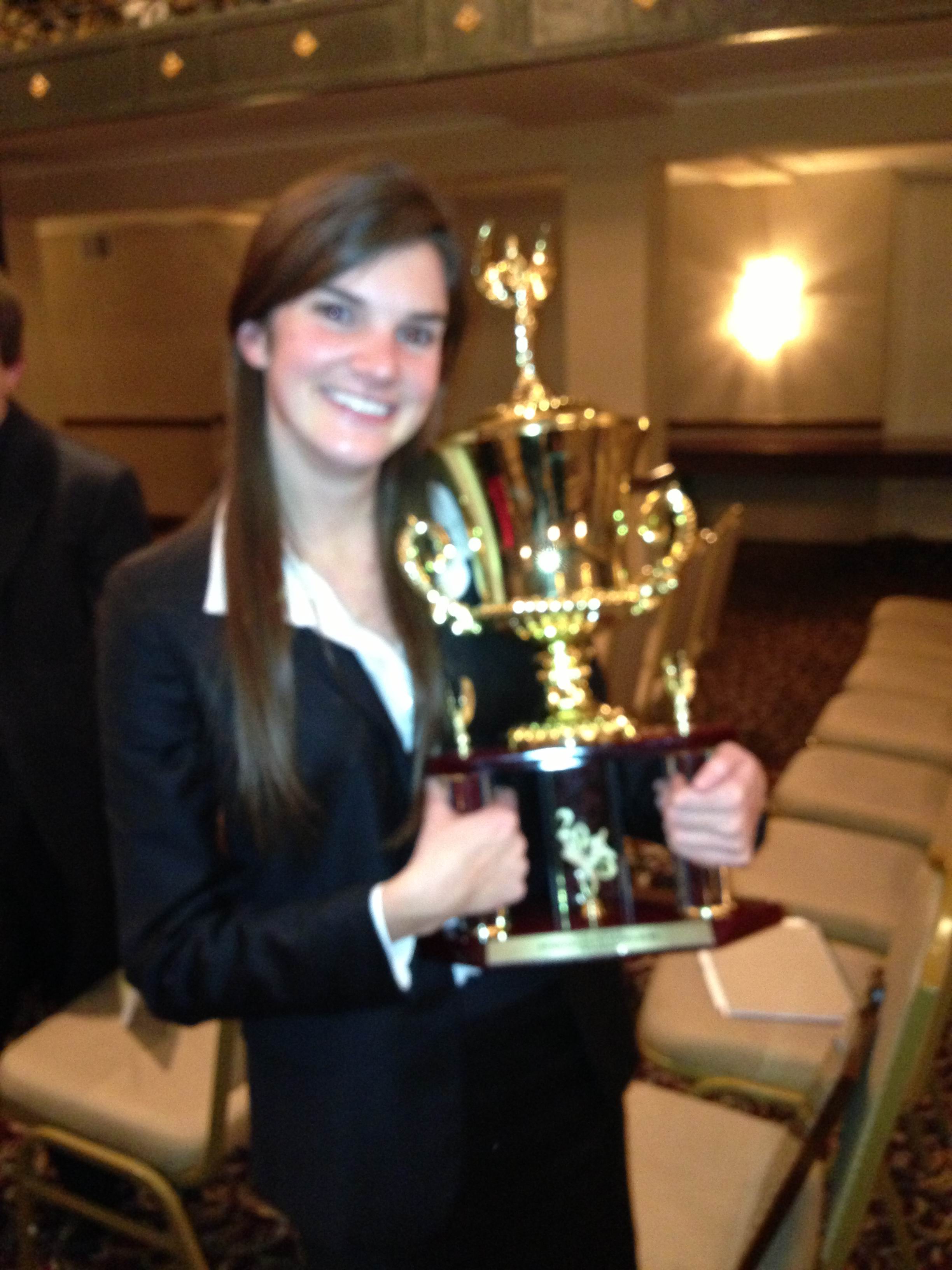 Sara Scully with the Ethics Bowl trophy