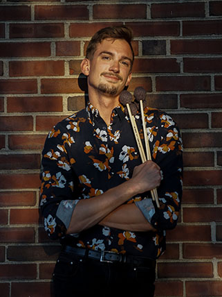 Josh Fulford Man holding percussion mallets