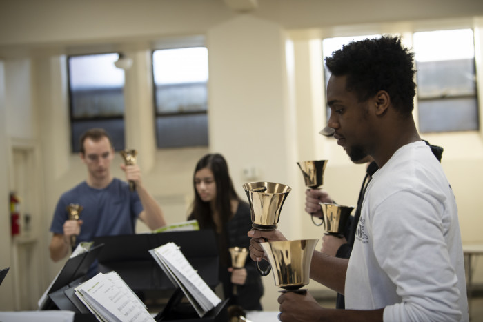 Students studying for their English handbell concert