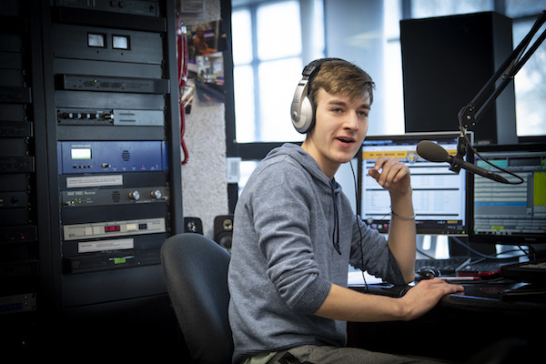 Student in the WGRE radio booth