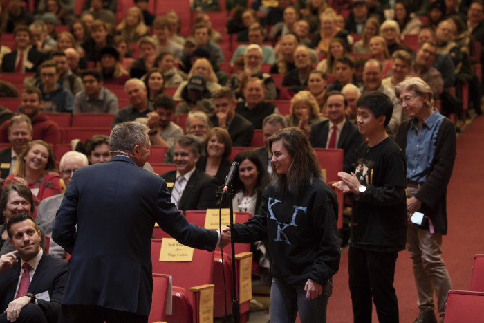 John Kasich shaking hands with students in line to ask questions