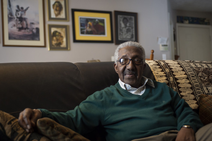 Stanley Warren at home on his couch