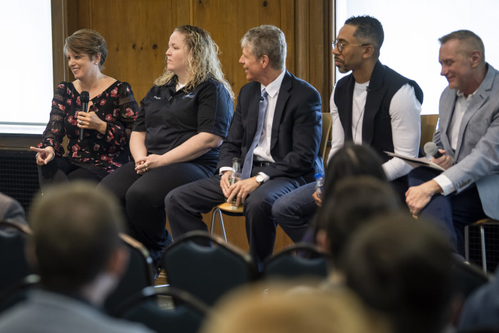 Guest speakers sitting together during a McDermond Center event