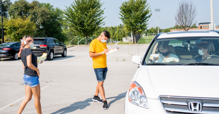 Students check in other students who are moving in 