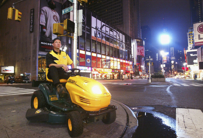 Brad Hauter on a lawnmower in Times Square