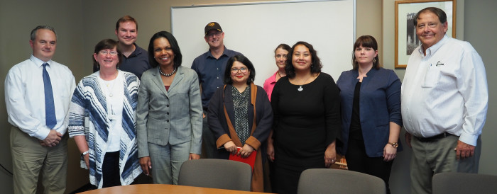 Condoleezza Rice posing with faculty
