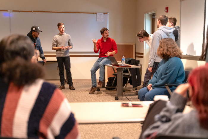 Alex Thompson '12 breaks down a scene with students.