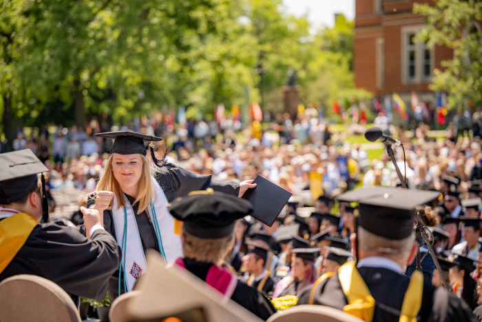 Graduation fist bump at DePauw commencement