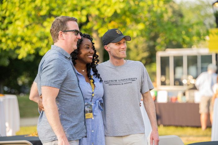 Alumni posing together during a reunion weekend