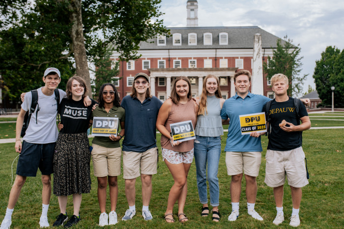 Students posing with first day of class 2025 signs